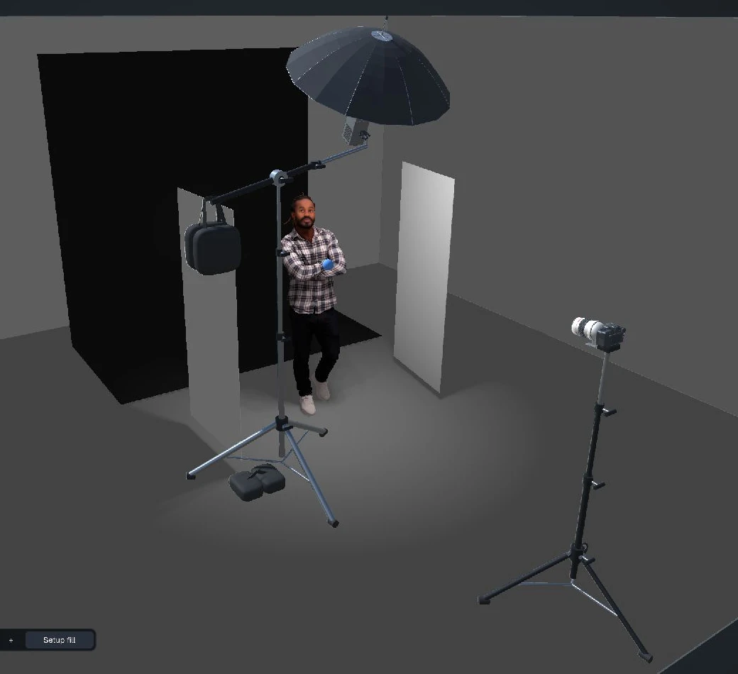 A one-light setup being arranged: umbrella on a boom arm with sandbags, two white boards, black backdrop and camera on a stand